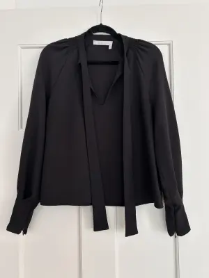 Red A shaped blouse with bow | LOOP Marketplace